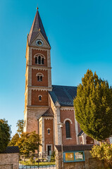 Fototapeta na wymiar Beautiful church on a sunny day in autumn at Fridolfing, Bavaria, Germany
