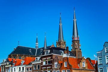 Delft, Netherlands - July 11, 2019: Colorful roofs of the brick houses in the town of Delft, the Netherlands