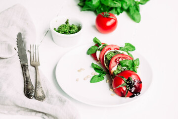 Caprese salad on a white plate