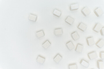sugar cubes on a light background Glucose ingredient