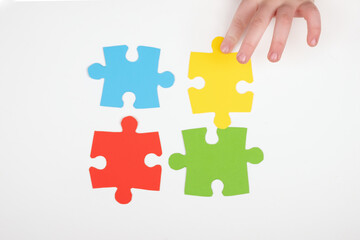 Fototapeta premium teaching children with autism, autism symbol,assembly of puzzles