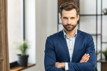 Successful serious authoritative confident young bearded brunet adult male entrepreneur businessman...