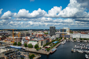 Obraz premium Antwerp, Belgium - July 12, 2019: Aerial view of the city of Antwerp in Belgium on a sunny summer day with beautiful clouds.