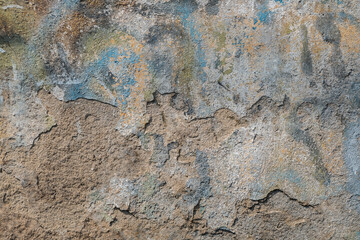 Textured surface of old concrete wall with cracks stands. Old wall texture grunge background. space...