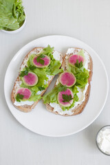 Tasty and delicious toast with lettuce, radish and cream cheese. Ketogenic diet. Healthy lifestyle.