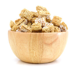 Breakfast setting with frosted wheat cereal in wood bowl
