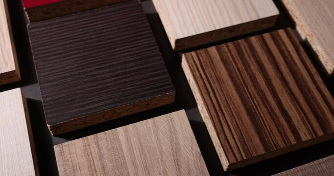 wooden laminate material samples on black background