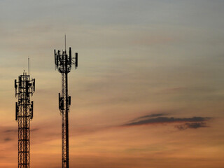 Obraz premium telecommunication tower antenna silhouette with beautiful sky background at sunset