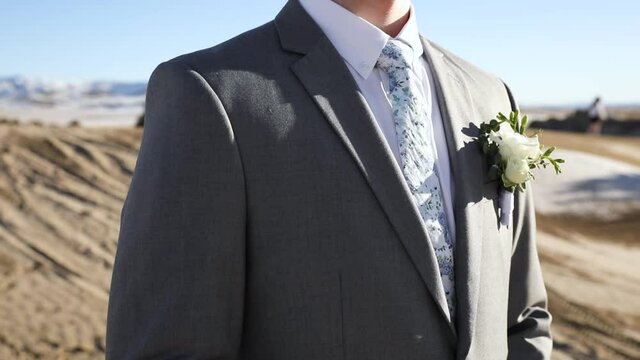 Wedding Concept -  Handsome Groom in Suit Jacket, Tie, and Floral Corsage