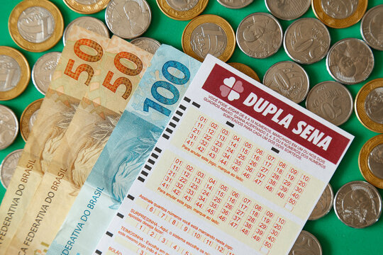 Cash, coin and lottery ticket Caixa Dupla Sena