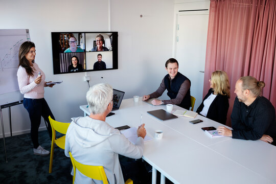 Woman Having Presentation At Business Meeting