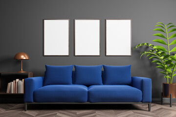 Modern scandinavian interior with blue sofa, wooden floor, gray wall and three blank posters. Mock up.