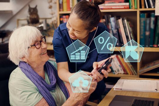 Home carer helping senior woman to use cell phone