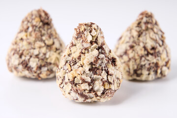 Chocolate candies on a white background. Sweets.