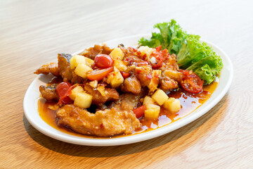 fried grouper fish topped with sweet ,sour and hot sauce