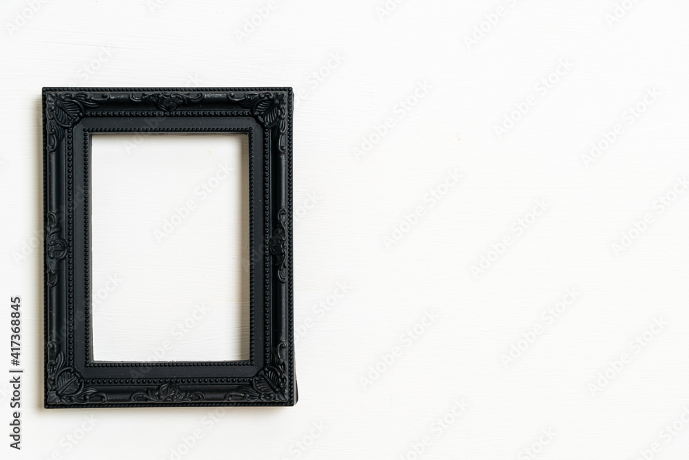 Wall mural empty picture frame on white wall background