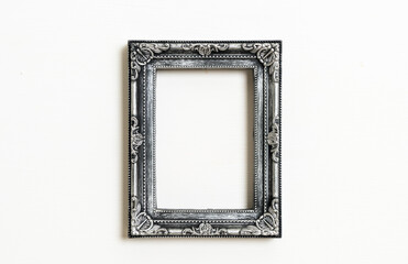 empty picture frame on white wall background