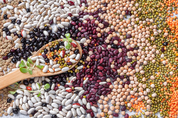 Legume abstract - top view of a variety of colorful bean, lentil and pea. Plant based food only.