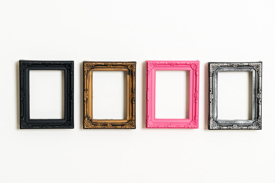 empty picture frame on white wall background