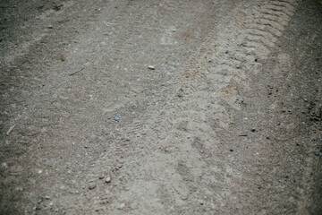 Tire tracks in a dirty road Background texture