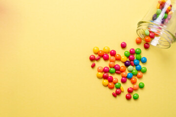 colorful little candies on a colored background