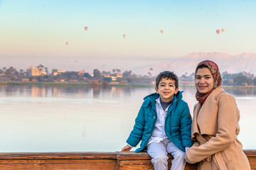 small family enjoying with the Nile river and the Egyptian civilization in Luxor ,Egypt