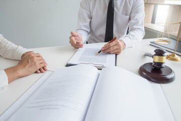 Lawyer discuss the contract and legal document agreement in office. Law and legal concept.