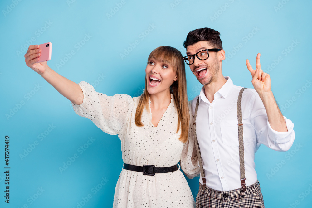 Sticker photo of funny sweet two persons dressed white clothes tacking selfie modern device showing v-sign i