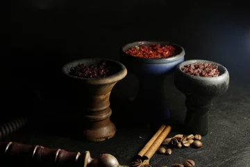 Papier Peint photo Lavable Café bowl with hookah tobacco. shisha with fruits on black background.