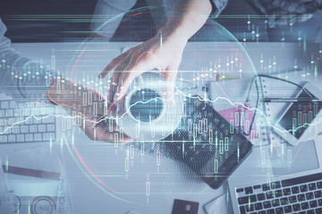 Double exposure of man and woman working together and financial chart hologram drawing. market analysis concept. Computer background. Top View.