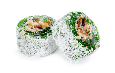 Green Turkish Delight with nuts on powdered sugar isolated on white