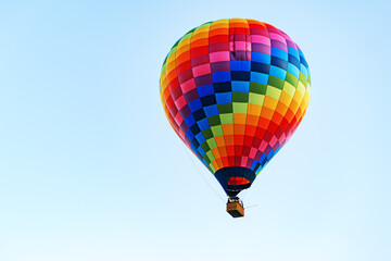 Fototapeta premium Multicolored air balloon in clear blue sky