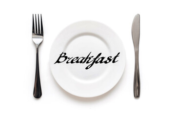 A white plate on which the word Breakfast is written standing on a tablecloth . The concept of a balanced diet, ration and medical fasting. Top view, white background, copy space.