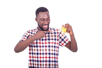 portrait of a handsome happy young man showing a glass of beer.