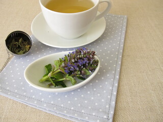 A cup of herbal tea with bugle