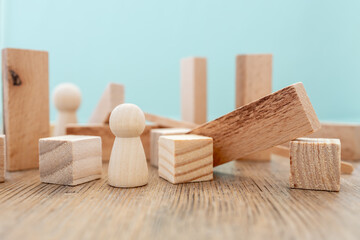 concept of loneliness, people separated by randomly arranged pieces of wood