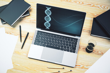 Modern computer monitor with creative DNA hologram. Bio Engineering and DNA Research concept. 3D Rendering