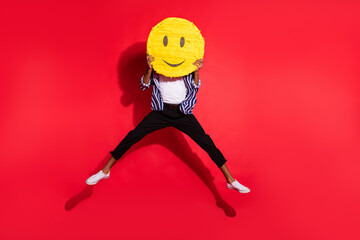 Full length body size view of funky guy jumping holding yellow like emoji closing face virtual...