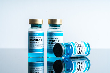 Medical concept ampoules or vials with Covid-19 vaccine on a laboratory bench
