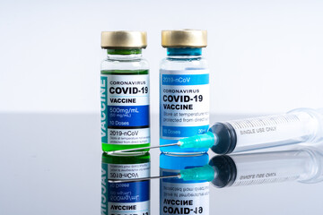 Medical concept ampoules or vials with Covid-19 vaccine on a laboratory bench