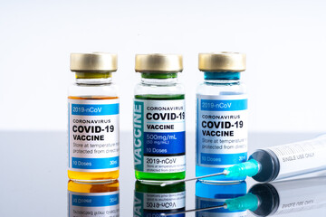 Medical concept ampoules or vials with Covid-19 vaccine on a laboratory bench