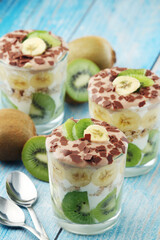 Trifle desserts with bananas, kiwi and yogurt