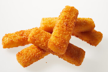 Appetizing bright fish sticks on white background