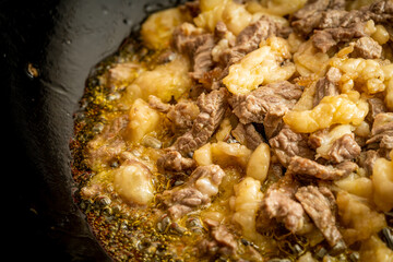 Fresh beef and suet being fried
