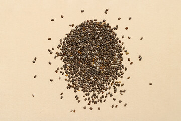 Chia seeds scattered on a bright background. A substitute for linseed. Healthy lifestyle and healthy nutrition.