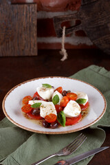 Salad with mozzarella, tomatoes and olives