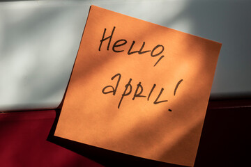 Hello april. a sticker with an inscription about the imminent arrival of spring and warmth