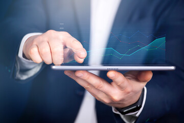 Close up of a businessman using tablet