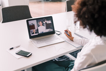 Businesswoman using laptop for video call
