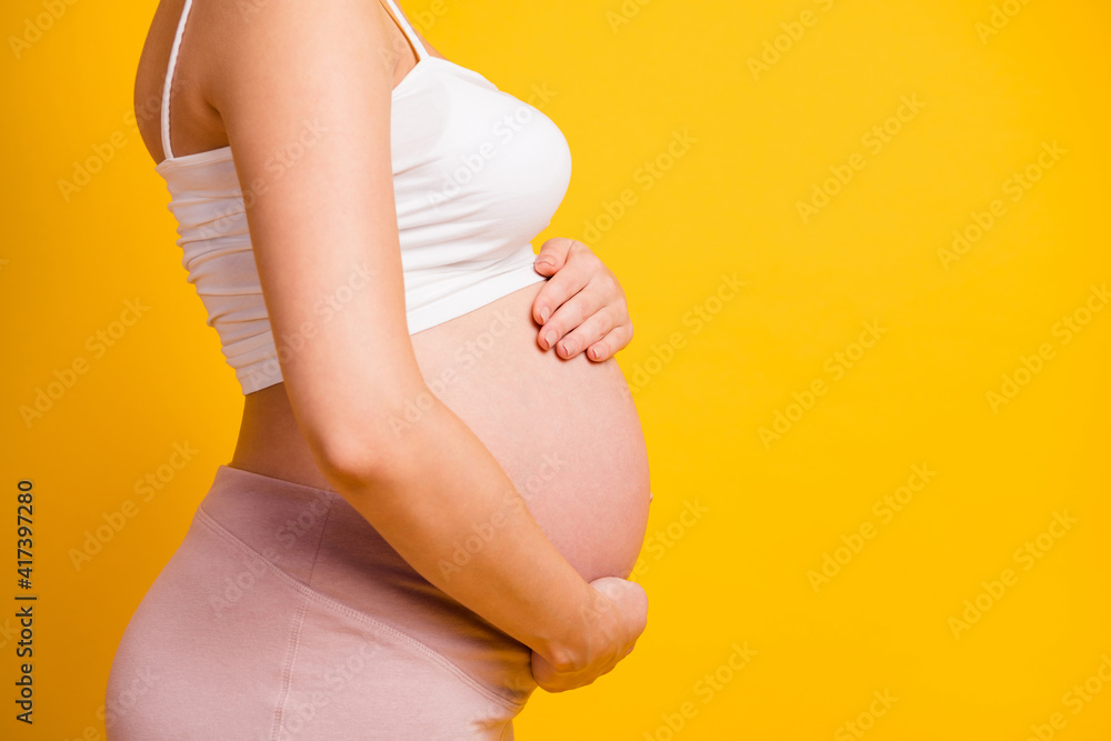 Sticker cropped photo of big lady tummy waiting baby dressed white clothes empty space isolated yellow color